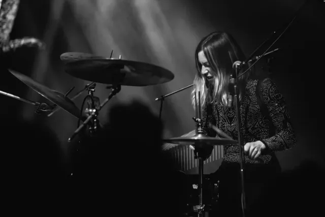 Michelle Milo behind the kit on stage